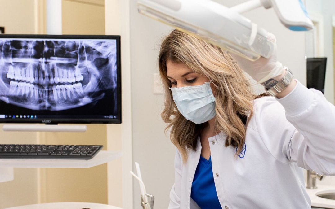 Dental assistant reviewing a customer's scan